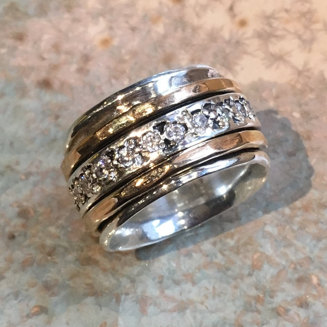 Clear zircons spinner ring